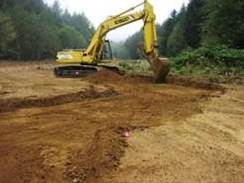 Figure 13. Excavation of the Anderson Creek high flow channel in the regraded Anderson Creek floodplain.  